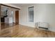 Bright room with hardwood floors that connects to the kitchen and features a lattice window at 1324 Virginia St, Idaho Springs, CO 80452