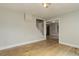 Open living space featuring hardwood floors, white trim, and stair access, creating a bright and airy atmosphere at 1324 Virginia St, Idaho Springs, CO 80452