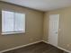 Bedroom featuring laminate flooring, a window providing natural light, and a closet at 4338 N Ceylon Ct, Denver, CO 80249