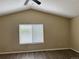 Cozy bedroom with vaulted ceilings, laminate floors, and ample natural light at 4338 N Ceylon Ct, Denver, CO 80249