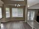 Bright dining area with modern lighting, laminate floors, and easy access to outdoor space at 4338 N Ceylon Ct, Denver, CO 80249
