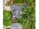 Aerial view highlighting the property's fruit trees, garden boxes, and layout at 6830 Lamar St, Arvada, CO 80003