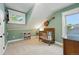 Cozy Bedroom featuring soft green walls, a crib, and natural light from two windows at 6830 Lamar St, Arvada, CO 80003