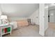 Attic bedroom featuring carpet, a single bed, and access to the hallway at 6830 Lamar St, Arvada, CO 80003