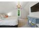 Bedroom features a chandelier, natural light, and neutral walls at 6830 Lamar St, Arvada, CO 80003