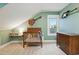 Charming Bedroom with soft green walls, a wooden crib, and stylish decor like guitars on the walls at 6830 Lamar St, Arvada, CO 80003