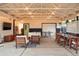 Relaxing covered patio with string lights, a comfortable lounge area, and a dining table at 6830 Lamar St, Arvada, CO 80003