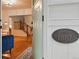 Charming home entryway highlighting the original 'Built 1887' plaque and staircase at 6830 Lamar St, Arvada, CO 80003