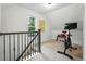 Upstairs exercise room with stationary bike offers a great workout space at 6830 Lamar St, Arvada, CO 80003