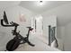 Bright exercise room with bike and open layout offers a great workout space at 6830 Lamar St, Arvada, CO 80003