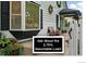 Charming home exterior with bay window and inviting front porch with assumable loan details at 6830 Lamar St, Arvada, CO 80003