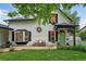 Charming two-story home with a quaint front porch and well-maintained landscaping at 6830 Lamar St, Arvada, CO 80003
