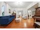 Bright living room with hardwood floors, comfortable seating, and modern decor at 6830 Lamar St, Arvada, CO 80003