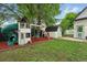 Backyard play area featuring a playhouse with a slide, swing set and storage shed at 6830 Lamar St, Arvada, CO 80003