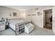 Cozy bedroom featuring a comfortable bed, soft lighting, and a soothing ambiance at 7755 E Quincy Ave # 207A3, Denver, CO 80237