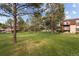 Expansive lawn with mature trees in a well-maintained community at 7755 E Quincy Ave # 207A3, Denver, CO 80237