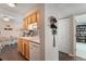 Efficient kitchen showcasing wood cabinetry and adjacent dining, great for entertaining and day-to-day tasks at 7755 E Quincy Ave # 207A3, Denver, CO 80237