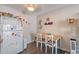 Functional kitchenette with a cozy dining area and essential appliances at 7755 E Quincy Ave # 207A3, Denver, CO 80237