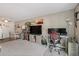 Open-concept living area with a home office setup and ample natural light at 7755 E Quincy Ave # 207A3, Denver, CO 80237