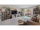 Inviting living room with balcony access, cozy gray couch, and a dedicated workspace at 7755 E Quincy Ave # 207A3, Denver, CO 80237