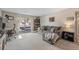 Relaxing living room featuring comfortable gray seating and access to a private balcony at 7755 E Quincy Ave # 207A3, Denver, CO 80237
