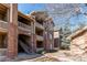 Multi-story apartment building with brick accents and private balconies at 1651 W Canal Cir # 613, Littleton, CO 80120