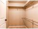 This closet boasts ample storage space with its shelving and closet rod, and neutral walls at 1651 W Canal Cir # 613, Littleton, CO 80120