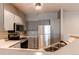 Efficient kitchen design features stainless steel appliances and practical layout at 1651 W Canal Cir # 613, Littleton, CO 80120