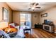 Cozy living room featuring hardwood floors, a ceiling fan, and a fireplace at 1651 W Canal Cir # 613, Littleton, CO 80120