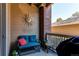 Private patio with comfortable seating and decorative sun decor at 1651 W Canal Cir # 613, Littleton, CO 80120