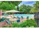 Inviting community swimming pool surrounded by comfortable lounge chairs and lush landscaping at 1651 W Canal Cir # 613, Littleton, CO 80120