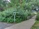 Inviting walking path leading to a charming wooden bridge surrounded by lush greenery at 1651 W Canal Cir # 613, Littleton, CO 80120
