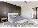 Modern bedroom with white bed and dark wall accents at 5191 Lions Paw St, Castle Rock, CO 80104