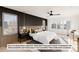 Bright bedroom with a king-size bed and wood accent wall at 5191 Lions Paw St, Castle Rock, CO 80104