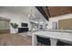 Open kitchen with large island and breakfast bar overlooking the living room at 5191 Lions Paw St, Castle Rock, CO 80104
