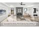 Spacious living room with gray sectional sofa and modern fireplace at 5191 Lions Paw St, Castle Rock, CO 80104