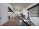 Open concept living area with hardwood floors and a modern fireplace at 5191 Lions Paw St, Castle Rock, CO 80104