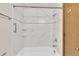 Bathroom featuring a fully tiled bath and shower with updated fixtures at 8871 E Amherst Dr # B, Denver, CO 80231