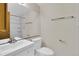 Bathroom featuring sink with cabinet, toilet, large mirror, and bath/shower at 8871 E Amherst Dr # B, Denver, CO 80231