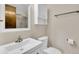 Bathroom featuring modern sink with cabinet, toilet, and bath/shower at 8871 E Amherst Dr # B, Denver, CO 80231