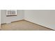 Bedroom featuring window providing natural light and neutral carpeting at 8871 E Amherst Dr # B, Denver, CO 80231