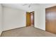 Bedroom featuring neutral wall and carpet colors, ceiling fan and wall closet at 8871 E Amherst Dr # B, Denver, CO 80231