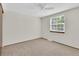 Bedroom featuring neutral carpet and walls, ceiling fan and window with blinds at 8871 E Amherst Dr # B, Denver, CO 80231
