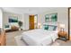 A staged bedroom featuring lamps and decorations at 8871 E Amherst Dr # B, Denver, CO 80231