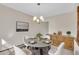 Elegant dining room with stylish light fixture, round table, and modern decor at 8871 E Amherst Dr # B, Denver, CO 80231