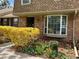 Charming brick home with a bay window and manicured landscaping, showcasing curb appeal at 8871 E Amherst Dr # B, Denver, CO 80231