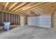 Spacious two car garage with concrete floor and door to enter, providing secure parking at 8871 E Amherst Dr # B, Denver, CO 80231