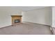Spacious living room with a brick fireplace and plush carpeting, perfect for relaxation at 8871 E Amherst Dr # B, Denver, CO 80231