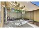 Cozy outdoor patio area with privacy fence, partial shade cover, and access to the backyard at 8871 E Amherst Dr # B, Denver, CO 80231