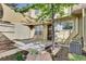 Private outdoor patio with shade and mature landscaping, perfect for entertaining or relaxing at 8871 E Amherst Dr # B, Denver, CO 80231